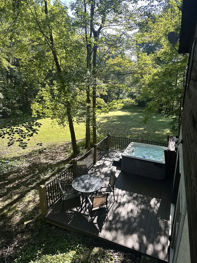Back deck and hot tub in summer shade