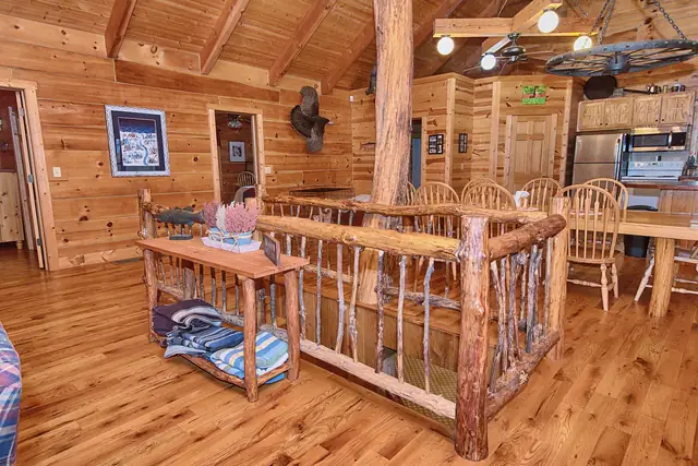 Handmade log railing around the stairway