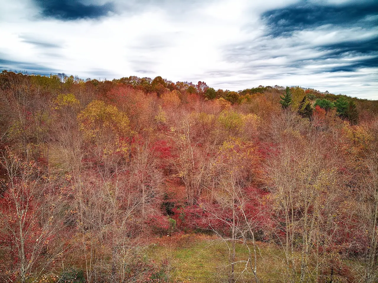 Fall color rolling across the hills of the 97-acre property