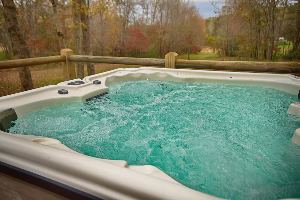 Bubbling hot tub with a view of fall color
