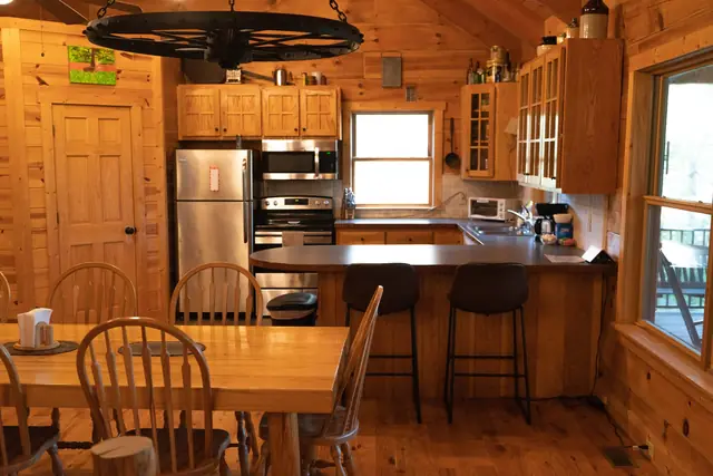Kitchen with breakfast bar and the long handmade dining table