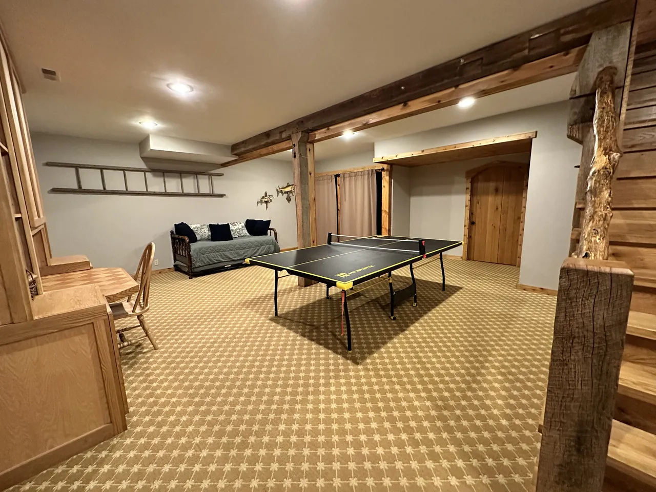 Ping pong table and daybed in the game room